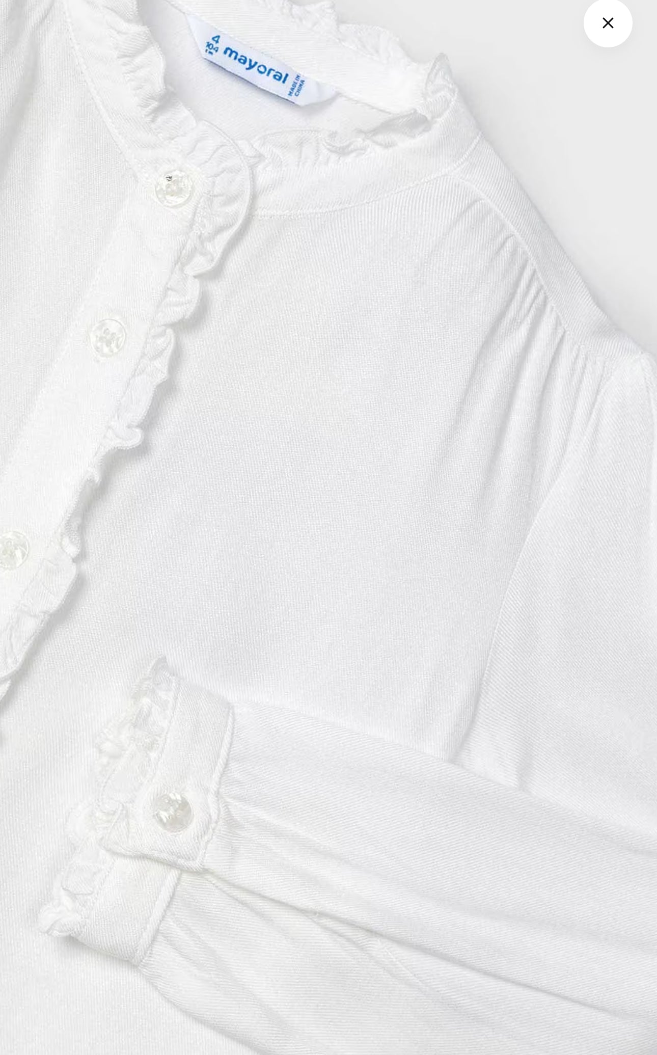 White ruffle shirt